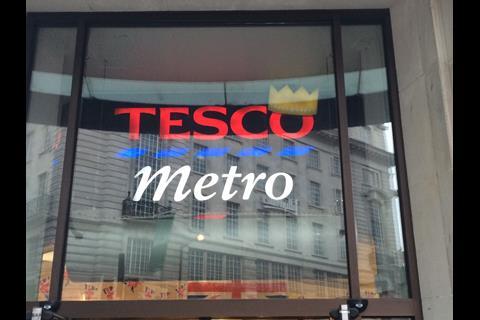 Tesco has marked the royal birth by transforming its traditional green Christmas hat logo into a Royal Crown